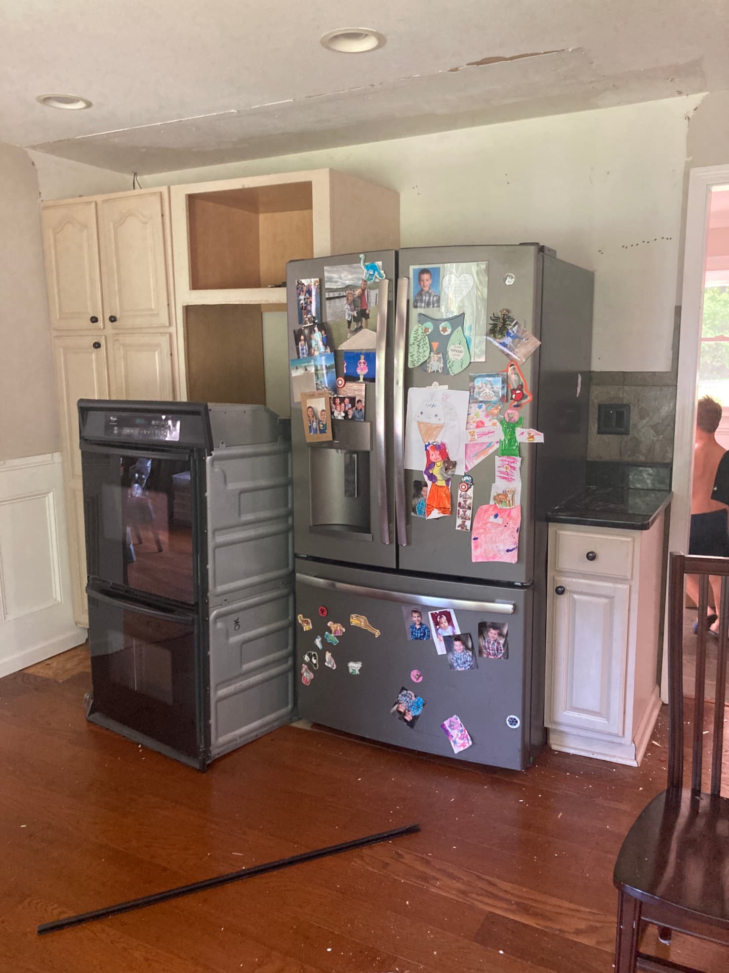 During kitchen renovation: double oven removed and upper cabinetry taken down